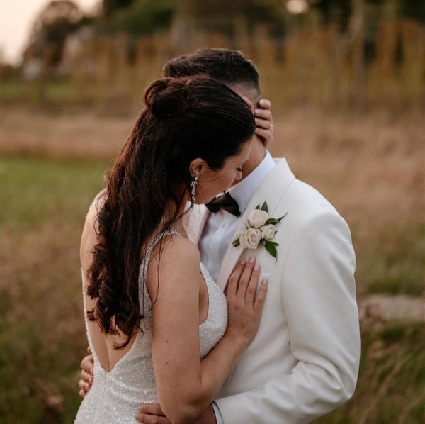 Lauren wore the Cruz crystal bridal statement earrings (silver) by Aria. Photography by Laura Martha Photography.