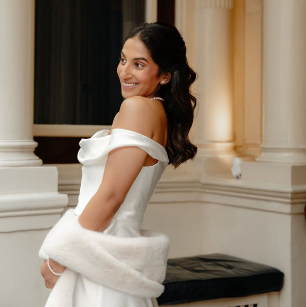 Thorrun wore the Reine ivory faux fur bridal wrap by Aria. Photography by Raquel Rose.