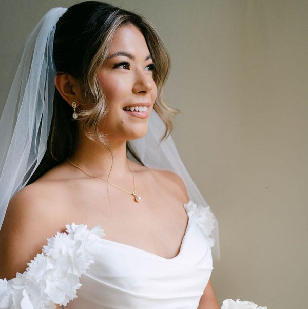 Anna wore the Minn zirconia and teardrop freshwater pearls earrings and Avery pearl pendant necklace by Aria. Photography by Frances Foster.