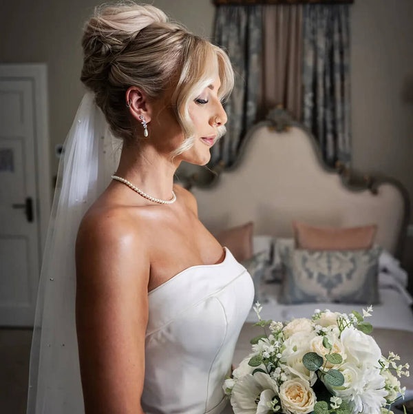 Vicky wore the Ashbourne crystal cluster pearl drop earrings by Ivory &amp; Co and the Alta pearl necklace by Aria. Photography by October James Photography.
